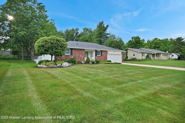 6716 Bunker Hill Dr, Lansing, MI 48906 - ranch-style house featuring a garage, brick siding, a front yard, and concrete driveway