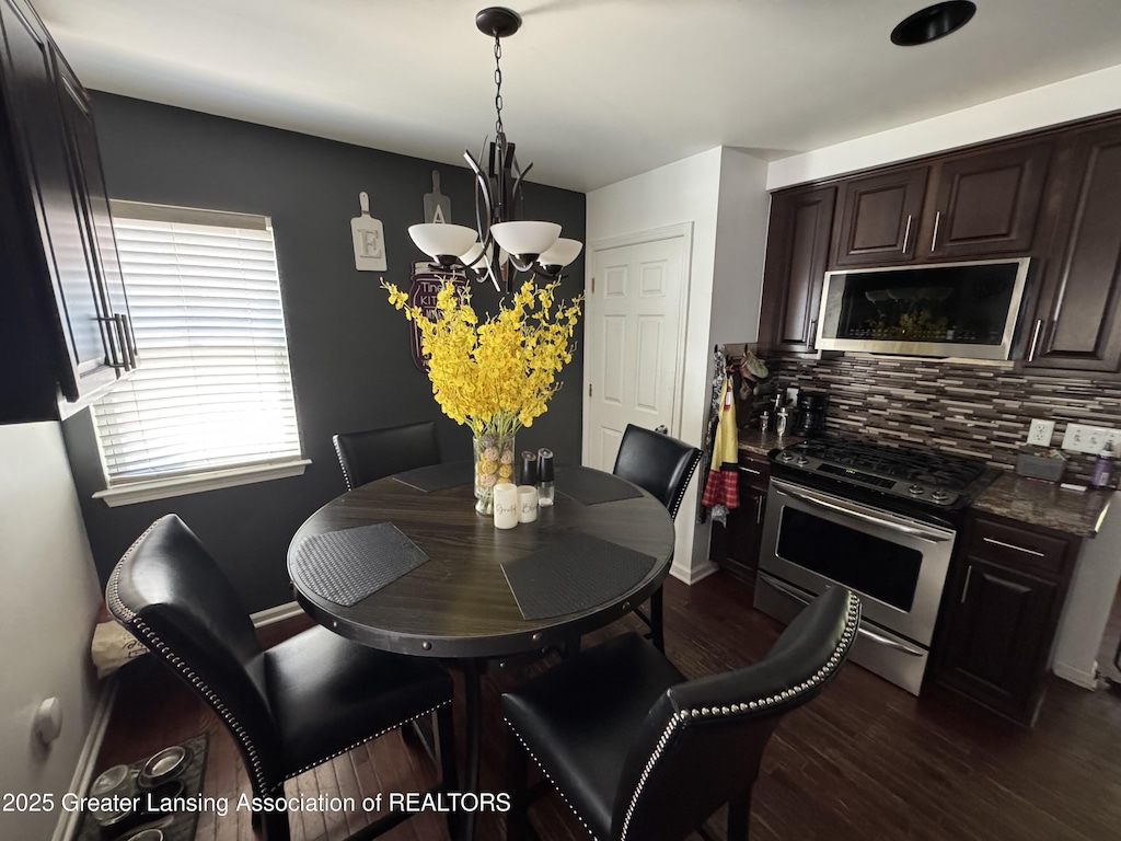 816 Arcola St, Garden City, MI 48135 - dining area with dark wood-style floors and a chandelier