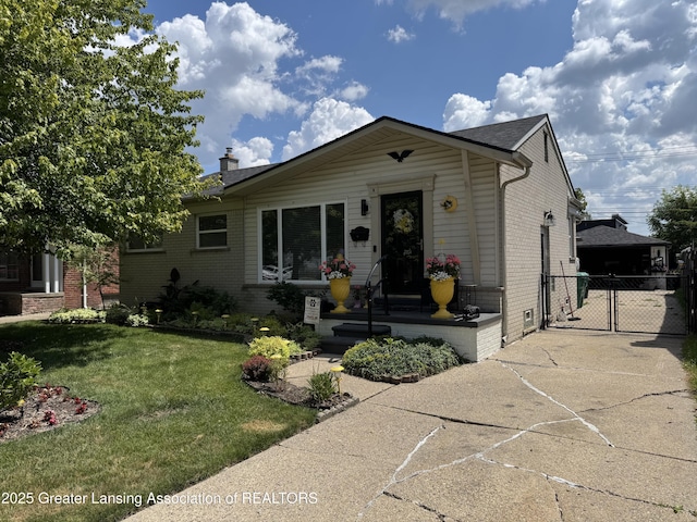 816 Arcola St, Garden City, MI 48135 - view of front of home with brick siding, a gate, a chimney, and concrete driveway