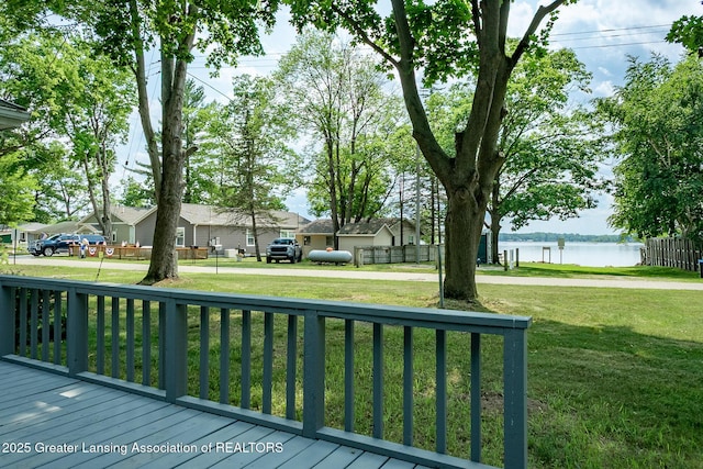 1337 Shepard St, Crystal, MI 48818 - deck featuring a water view and a lawn