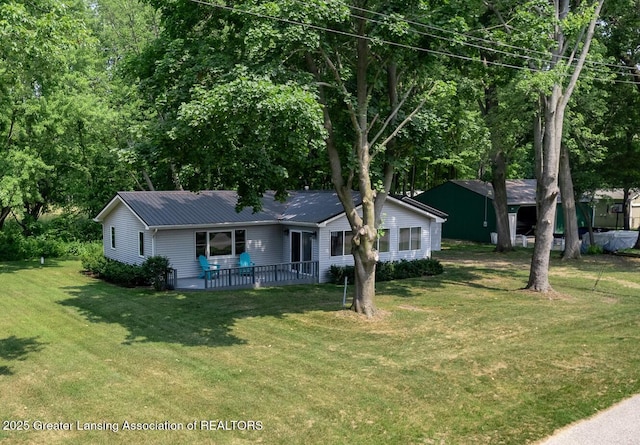 1337 Shepard St, Crystal, MI 48818 - single story home featuring a front yard and a metal roof