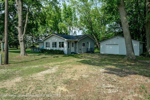 1337 Shepard St, Crystal, MI 48818 - single story home with a detached garage, an outdoor structure, dirt driveway, and a front lawn