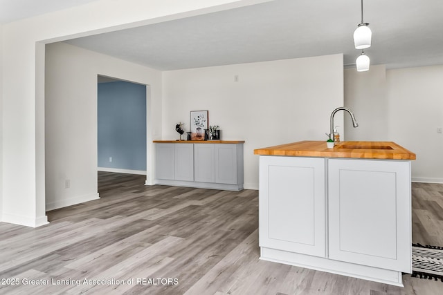 1337 Shepard St, Crystal, MI 48818 - bar with light wood-style floors and pendant lighting