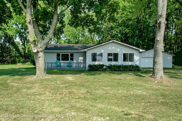 1337 Shepard St, Crystal, MI 48818 - single story home featuring a front yard, a deck, a metal roof, and a garage