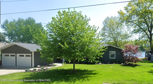 4813 Lakeside Dr, Perrinton, MI 48871 - view of front facade featuring a front yard and concrete driveway