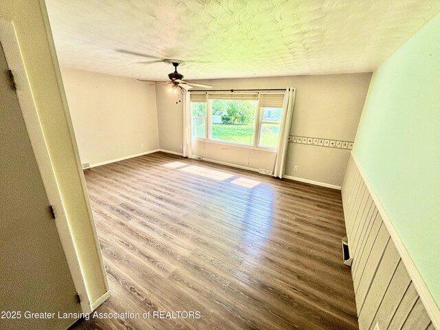 1214 Otto Rd Unit R1, Charlotte, MI 48813 - spare room with a ceiling fan, wood finished floors, and a textured ceiling
