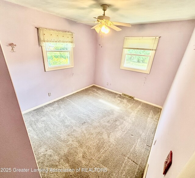 1214 Otto Rd Unit R1, Charlotte, MI 48813 - carpeted spare room featuring a ceiling fan and baseboards