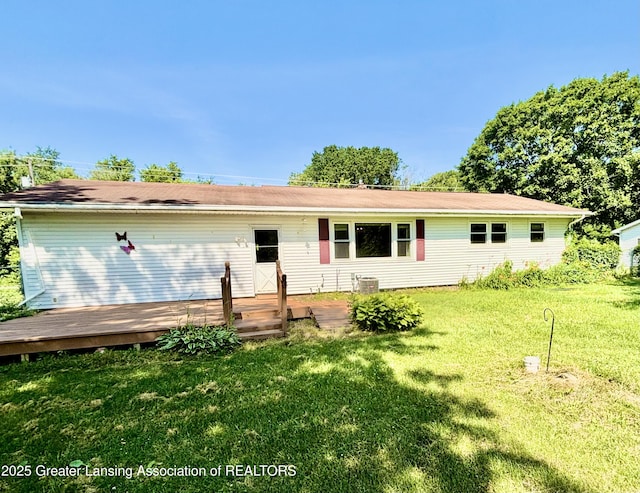 1214 Otto Rd Unit R1, Charlotte, MI 48813 - ranch-style home featuring a front lawn and a wooden deck