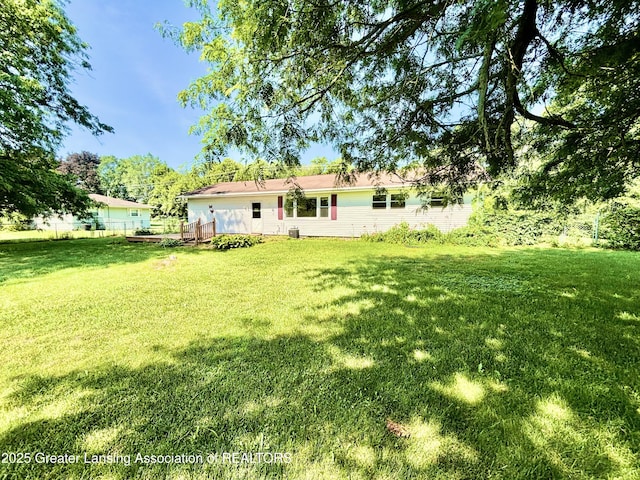 1214 Otto Rd Unit R1, Charlotte, MI 48813 - back of property with a yard