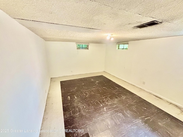 1214 Otto Rd Unit R1, Charlotte, MI 48813 - below grade area featuring a textured ceiling