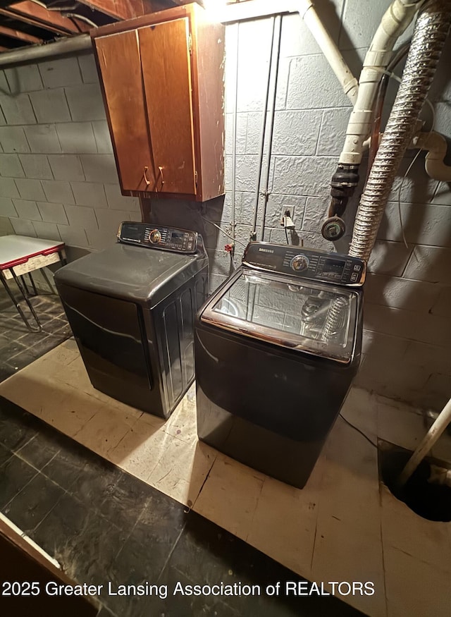 1214 Otto Rd Unit R1, Charlotte, MI 48813 - washroom with cabinet space and independent washer and dryer