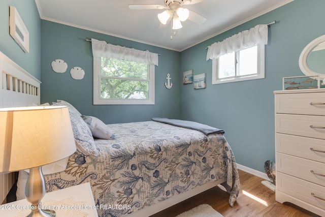 1220 Seymour St, Grand Ledge, MI 48837 - bedroom featuring wood finished floors, crown molding, and a ceiling fan