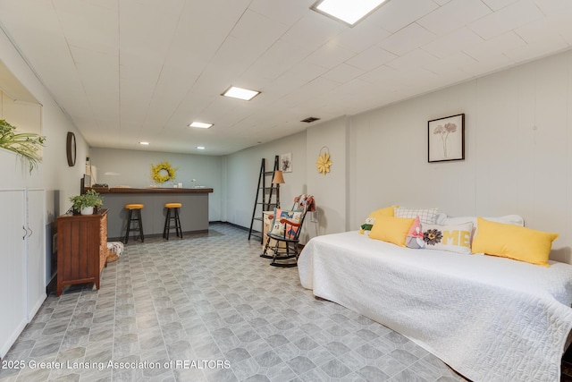 1220 Seymour St, Grand Ledge, MI 48837 - bedroom featuring a dry bar and tile patterned floors