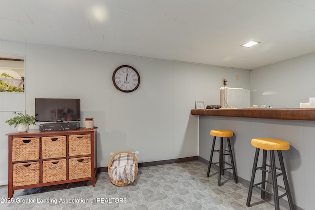 1220 Seymour St, Grand Ledge, MI 48837 - indoor bar with freestanding refrigerator and baseboards