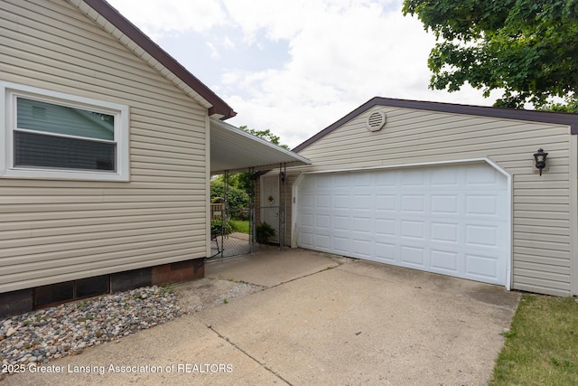 1220 Seymour St, Grand Ledge, MI 48837 - view of side of home with an outdoor structure, a garage, and a gate