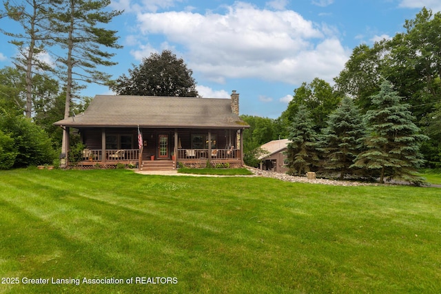 3536 N Royston Rd, Potterville, MI 48876 - back of house featuring a porch, a chimney, and a lawn