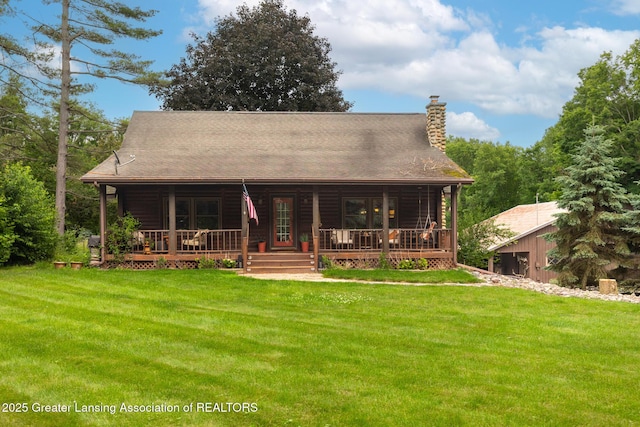 3536 N Royston Rd, Potterville, MI 48876 - cabin with covered porch, a front lawn, and a chimney