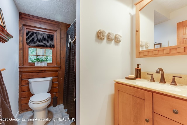 3536 N Royston Rd, Potterville, MI 48876 - full bath with vanity, tile patterned floors, and a textured ceiling