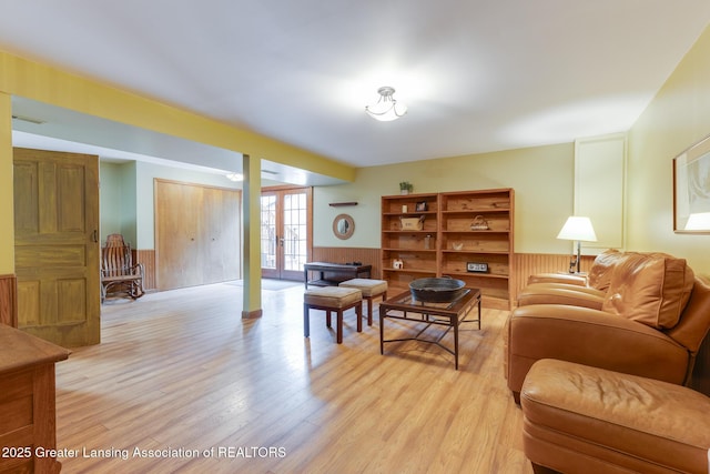 3536 N Royston Rd, Potterville, MI 48876 - living area featuring light wood-type flooring and a wainscoted wall
