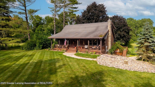 3536 N Royston Rd, Potterville, MI 48876 - log home featuring a front yard, a porch, and a chimney
