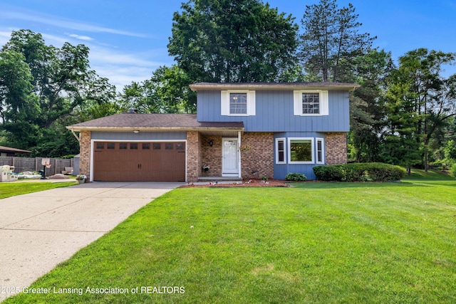 4629 Grandwoods Dr, Lansing, MI 48917 - view of front of home featuring an attached garage, brick siding, and concrete driveway