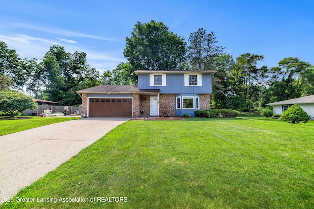 4629 Grandwoods Dr, Lansing, MI 48917 - view of front of house featuring brick siding, a garage, and driveway