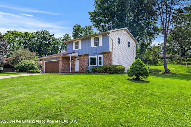 4629 Grandwoods Dr, Lansing, MI 48917 - view of front of house with brick siding, a front yard, a garage, and driveway