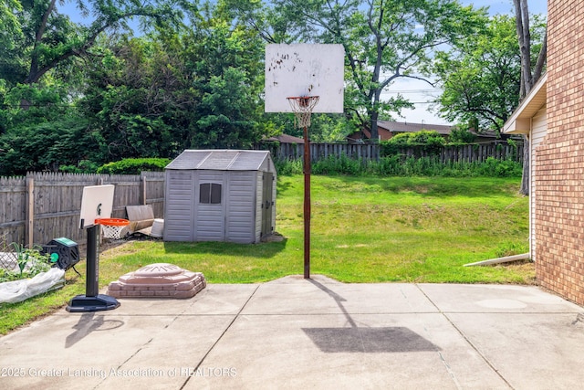 4629 Grandwoods Dr, Lansing, MI 48917 - fenced backyard featuring a storage shed and a patio