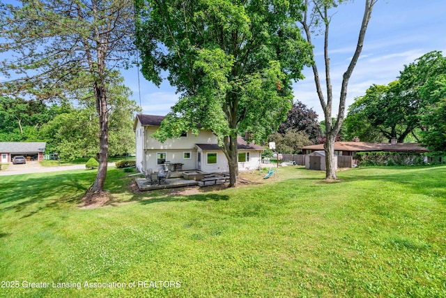 4629 Grandwoods Dr, Lansing, MI 48917 - view of yard featuring a patio area