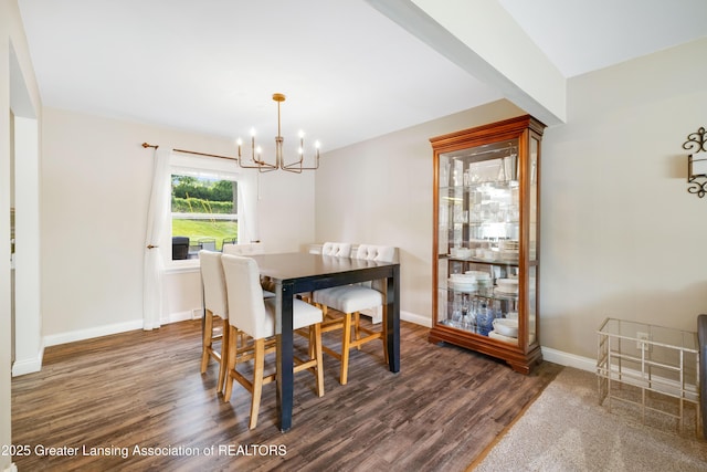 4629 Grandwoods Dr, Lansing, MI 48917 - dining space featuring a chandelier and dark wood-type flooring