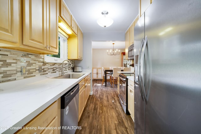 4629 Grandwoods Dr, Lansing, MI 48917 - kitchen with stainless steel appliances, dark wood-style floors, and light brown cabinetry