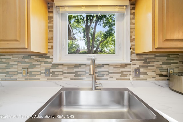 4629 Grandwoods Dr, Lansing, MI 48917 - kitchen view of light brown cabinets and backsplash