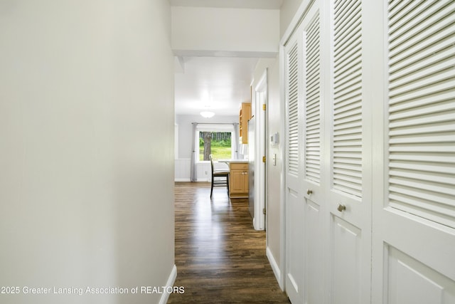 4629 Grandwoods Dr, Lansing, MI 48917 - hall with dark wood-style flooring and baseboards