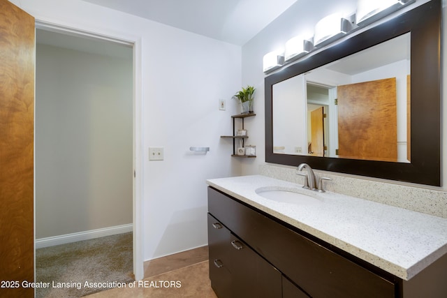 4629 Grandwoods Dr, Lansing, MI 48917 - bathroom with vanity and baseboards