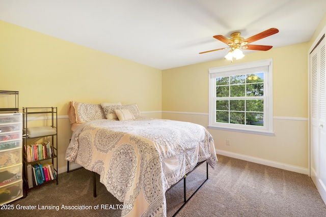 4629 Grandwoods Dr, Lansing, MI 48917 - carpeted bedroom with a closet and ceiling fan