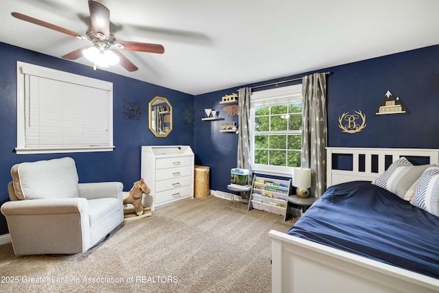 4629 Grandwoods Dr, Lansing, MI 48917 - bedroom featuring carpet floors and ceiling fan