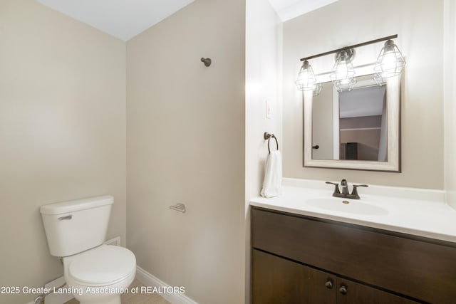 4629 Grandwoods Dr, Lansing, MI 48917 - bathroom featuring vanity and toilet