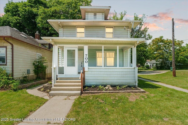 700 S Pennsylvania Ave, Lansing, MI 48912 - american foursquare style home with covered porch and a front lawn