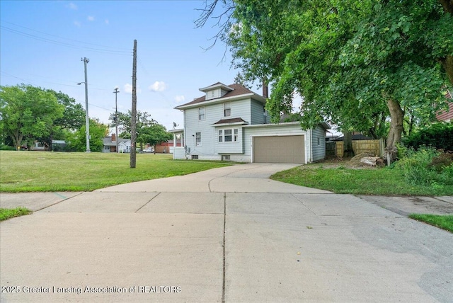700 S Pennsylvania Ave, Lansing, MI 48912 - american foursquare style home featuring driveway and a garage