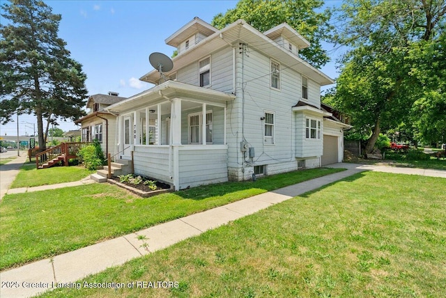 700 S Pennsylvania Ave, Lansing, MI 48912 - view of property exterior featuring driveway, a yard, covered porch, and a garage