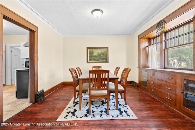 700 S Pennsylvania Ave, Lansing, MI 48912 - dining area with ornamental molding and dark wood finished floors