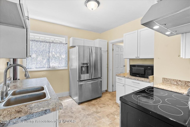 700 S Pennsylvania Ave, Lansing, MI 48912 - kitchen featuring black appliances, ventilation hood, white cabinets, and light countertops