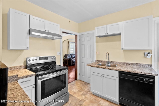 700 S Pennsylvania Ave, Lansing, MI 48912 - kitchen with stainless steel electric range oven, black dishwasher, under cabinet range hood, and white cabinetry