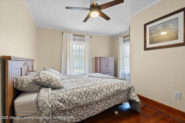 700 S Pennsylvania Ave, Lansing, MI 48912 - bedroom featuring wood-type flooring, ornamental molding, a ceiling fan, and a textured wall