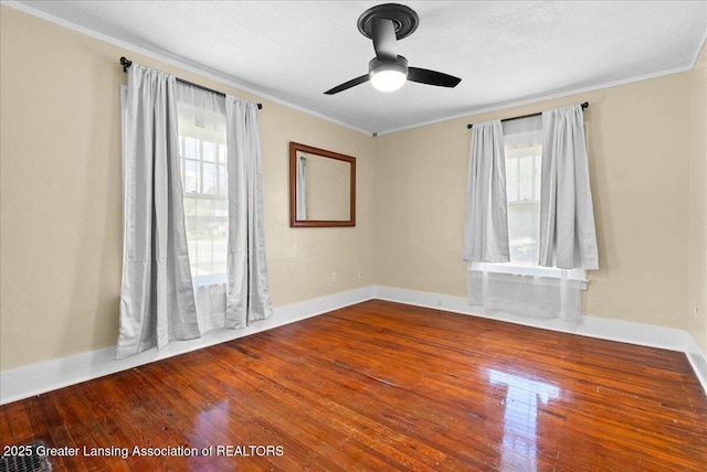 700 S Pennsylvania Ave, Lansing, MI 48912 - unfurnished room with plenty of natural light, crown molding, wood finished floors, and ceiling fan