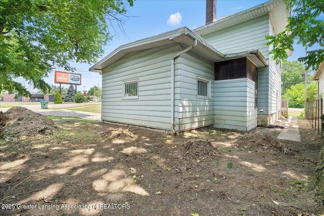 700 S Pennsylvania Ave, Lansing, MI 48912 - view of property exterior with a chimney