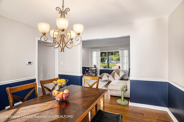4326 Manitou Dr, Okemos, MI 48864 - dining room with wood finished floors and a chandelier