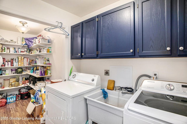 4326 Manitou Dr, Okemos, MI 48864 - laundry room with cabinet space, washing machine and clothes dryer, and wood finished floors