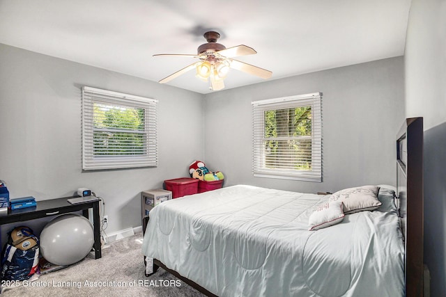 4326 Manitou Dr, Okemos, MI 48864 - carpeted bedroom with multiple windows and ceiling fan