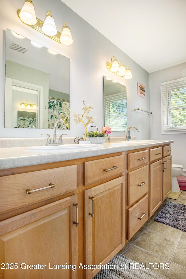 4326 Manitou Dr, Okemos, MI 48864 - full bath with double vanity and toilet